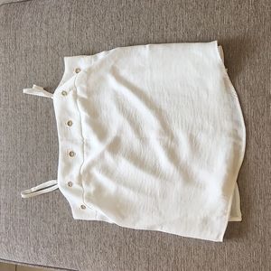 White top adjustable straps polyester lining.